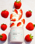 Whipped sugar scrub with strawberries on a light background