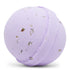A purple bath bomb with embedded dried lavender buds, designed to turn a boring bath into a foamy, fun, refreshing soak.