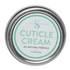 A metal tin container with a label that reads 'CUTICLE CREAM' and 'ALL NATURAL FORMULA', indicating that it is an artisan-made cuticle cream.