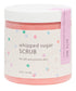 A jar of pink whipped sugar scrub with a label that reads 'whipped sugar SCRUB for soft and yummy skin'. The container is labeled 'BITE ME'.