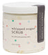 A jar of Whipped Sugar Scrub with multicolored dots pattern on the label, titled 'TOBACCO FLOWER' for soft and yummy skin.