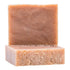 A bar of soap with a smooth, solid texture, primarily beige in color with a mottled appearance.